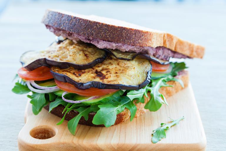 grilled eggplant on bread with crumbled cheese